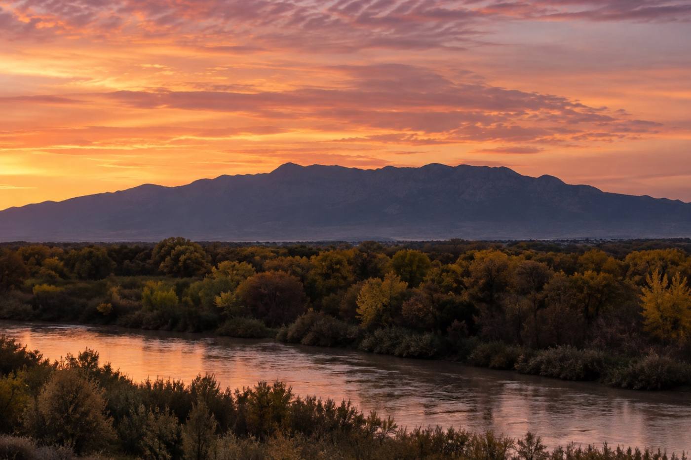 The Sandia Mountains at dusk seen across the Rio Grande valley